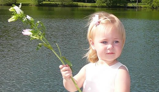 Forge Valley Event Center | Hendersonville, Brevard, Asheville | a young guest with flowers