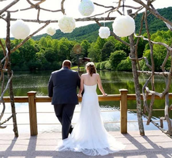 Forge Valley Event Center | Hendersonville, Brevard, Asheville | bride and groom on the dock overlooking the lake in the blue ridge mountains